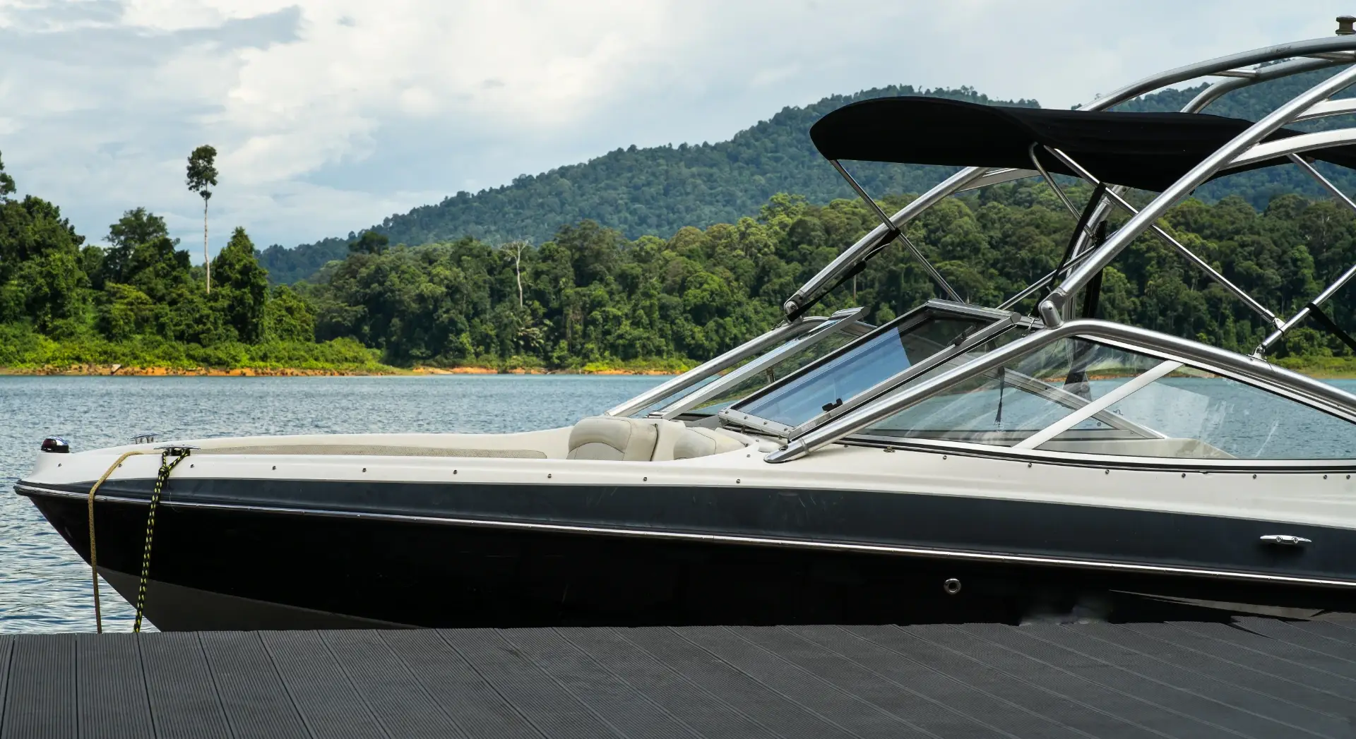 a-wakeboard-boat-at-a-wooden-dock-in-the-kenyir