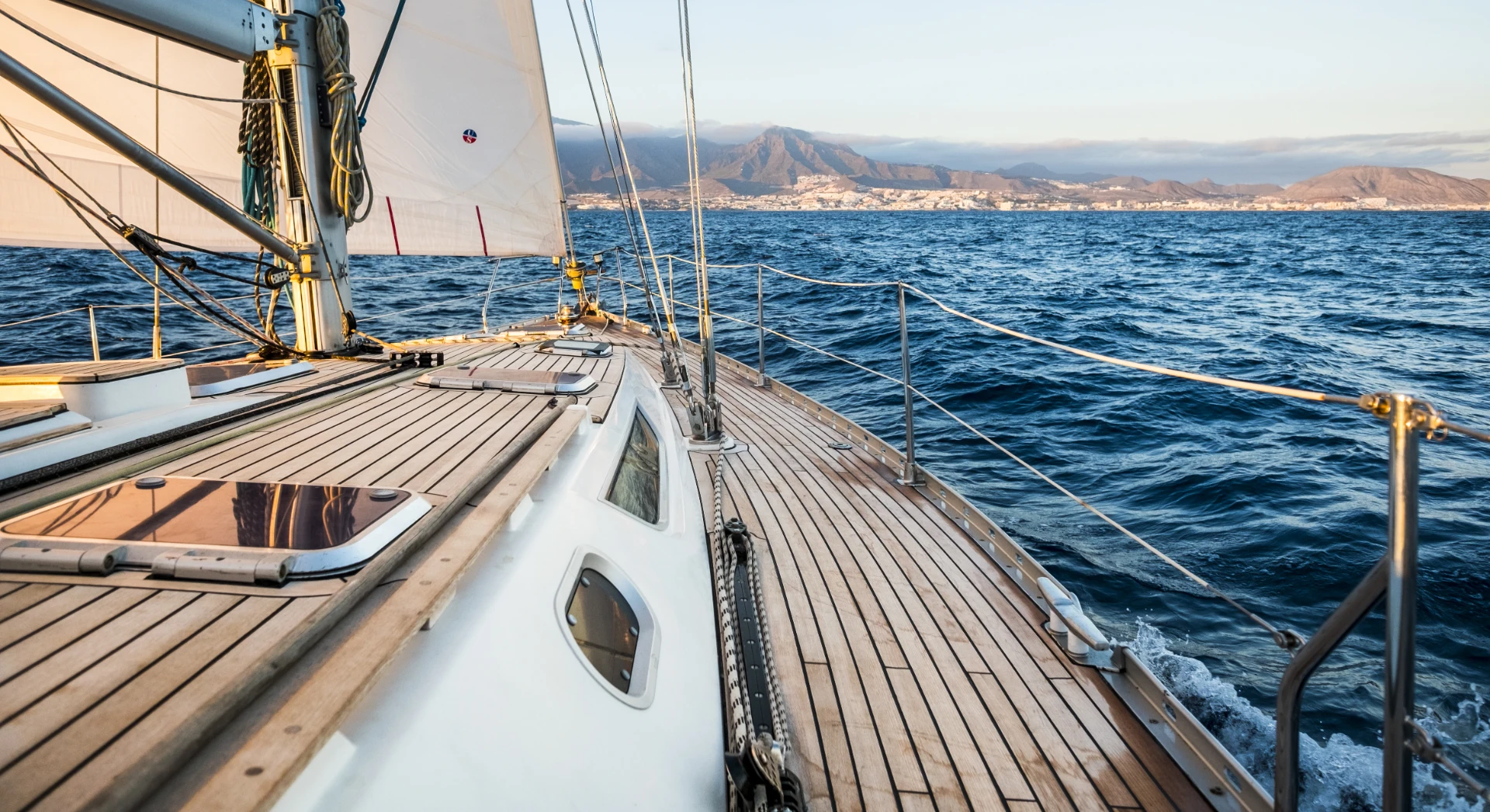 sailing-on-open-water-towards-distant-shore
